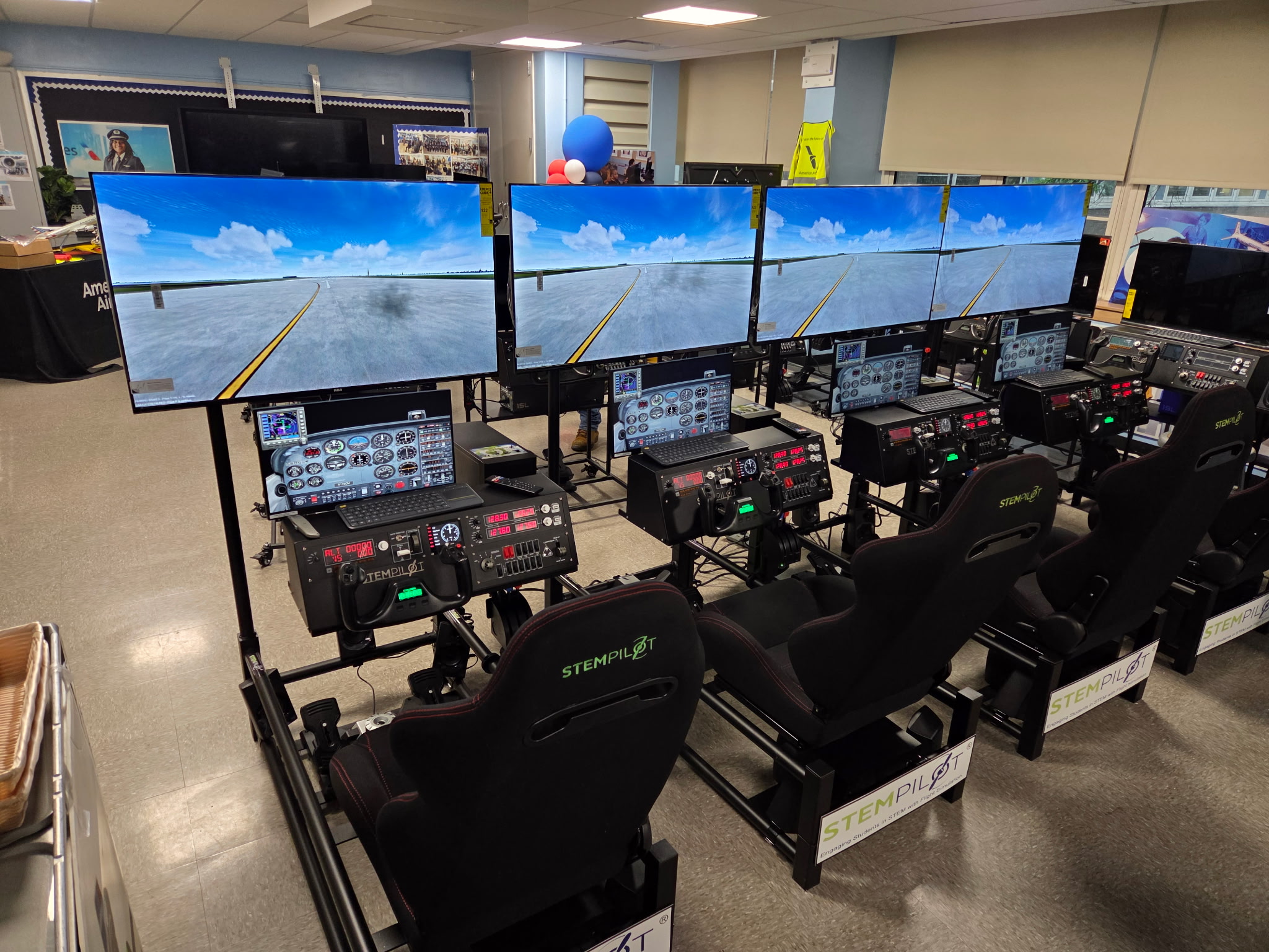 Photo of several flight simulators set up for the new Aviation Lab in P.S. 005 Dr. Ronald McNair!